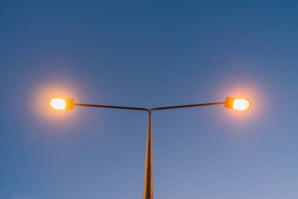 istock Upper view of light street pole on sunset time. 1456182389