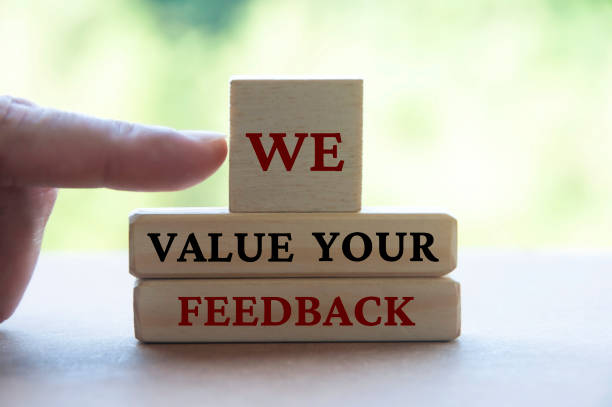 istock We value your feedback text on wooden blocks. Feedback and review concept 1456185033