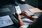 Close Up Photo Of Woman Hands Using A Mobile Phone In The Cafe