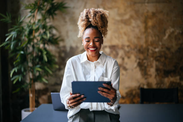 istock Happy Businesswoman Using A Digital Tablet In The Cafe 1456192915