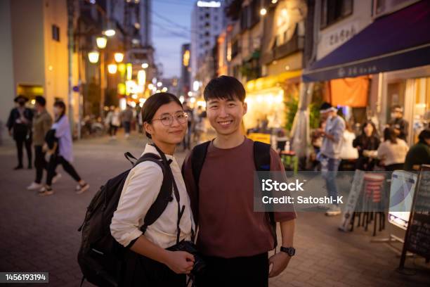 Portrait Of Asian Tourist Standing On Street At Night Stock Photo - Download Image Now