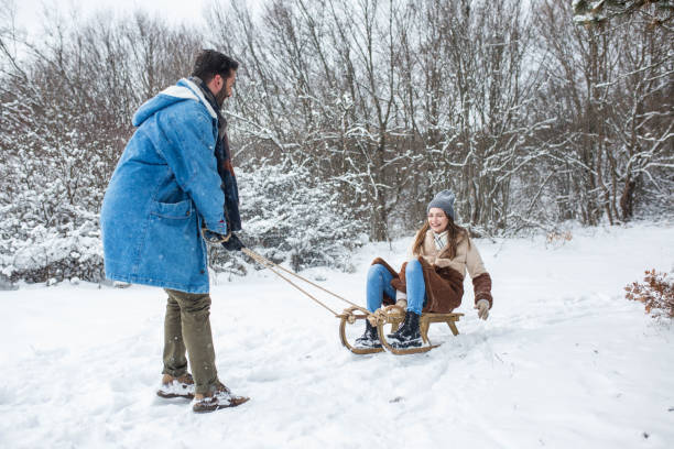 istock Friends having fun on a snowy winter day 1456193455