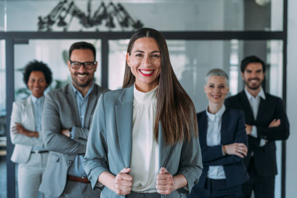 istock Confident businesswoman and her team. 1456194350
