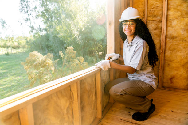 istock Construction trainee working in wooden house interior 1456194691