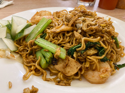 Mie Goreng Udang or Bakmi Goreng Sea Food or Fried Noodle with Sea Food. Indonesian food and cuisine, Adopted from Chinese cuisine.