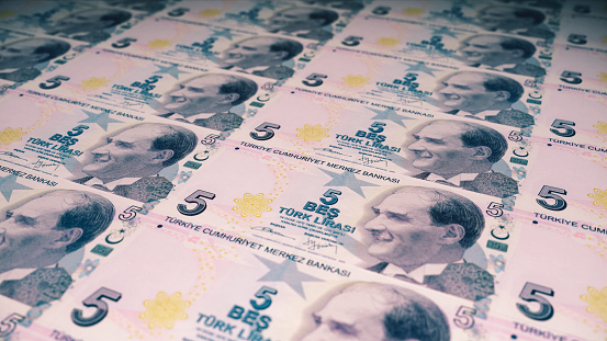 3d render 5 Turkish Lira Front coming out of the printing press (depth Of Field)