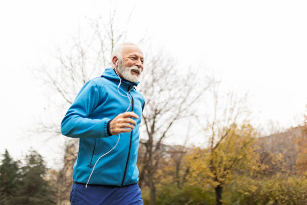 istock Mature man running in park 1456198225