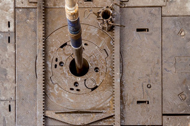 Drilling rig view with Top Drive, many pipes, sky bottom up view in sunny weather in Siberia