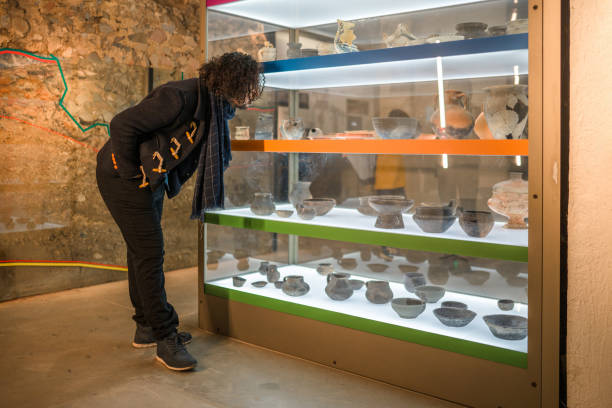 istock Mid Adult Museum Visitor Looking at a Display 1456200808