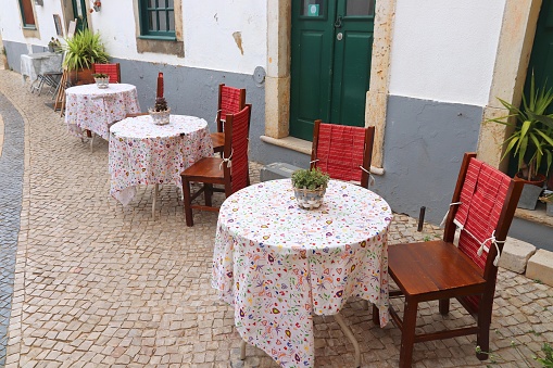 Portugal sidewalk cafe - Faro Old Town. Colorful old Portuguese street.
