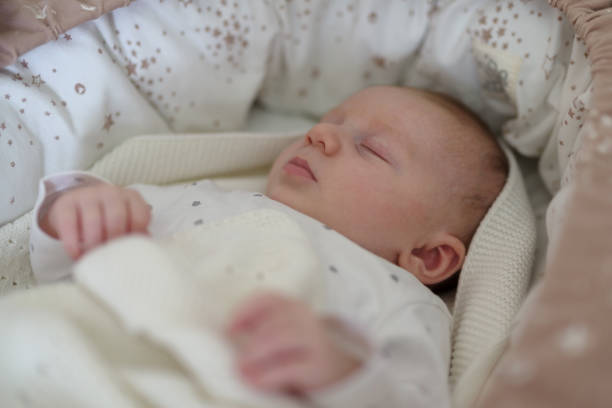 istock Newborn baby boy sleeping in bed 1456205552