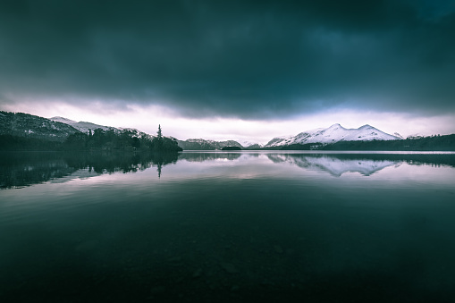 Threatening dark clouds covering the sky above Derwentwater in The English Lake District