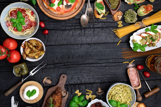 istock Dinning table full of food with copy space in center 1456210658