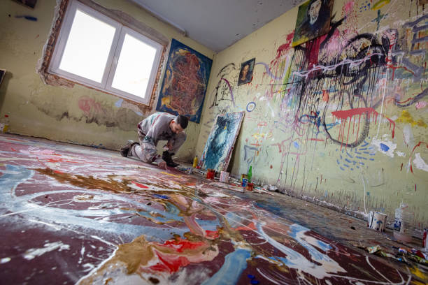 istock Modern artist painting in his art studio 1456211869