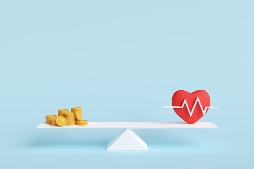 Red heart and gold coins in balance on scale. concept of health care costs, hospital rates, stay healthy, heart rate, heart disease. 3D illustration.