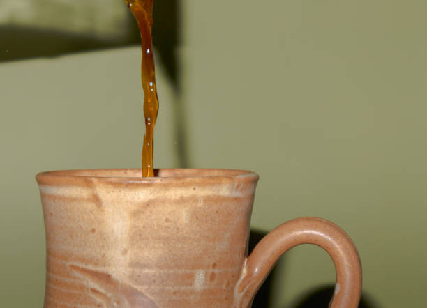 istock Close-up view of coffee being poured into a mug 1456213882