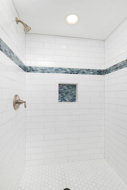 istock A shower with white and blue tiles. 1456214104