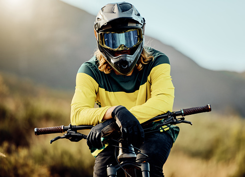 Dirt bike, bicycle and athlete portrait to ride in competitive cycling competition for adventure. Extreme sport, moto and rider waiting for cycle sport and activity for fitness, health and bmx