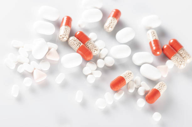 istock pills and capsules on white background 1456215648