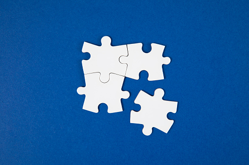 space a piece of jigsaw to connect success on wooden table top selected focus