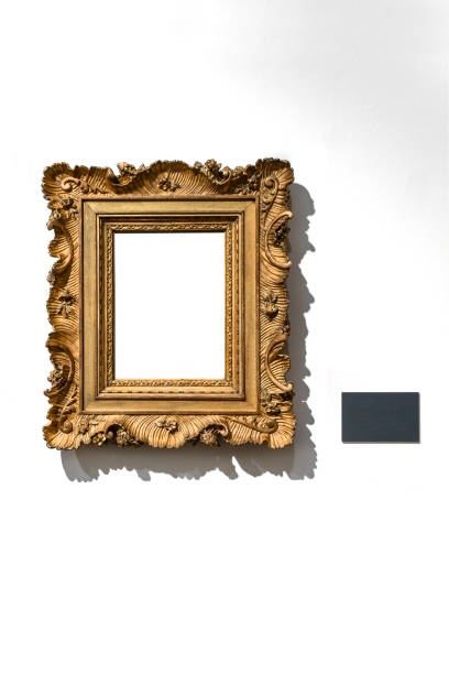 istock Golden vintage frame isolated on white wall in museum. 1456218739