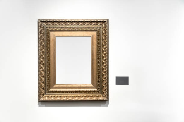 istock Golden vintage frame isolated on white wall in museum. 1456218804