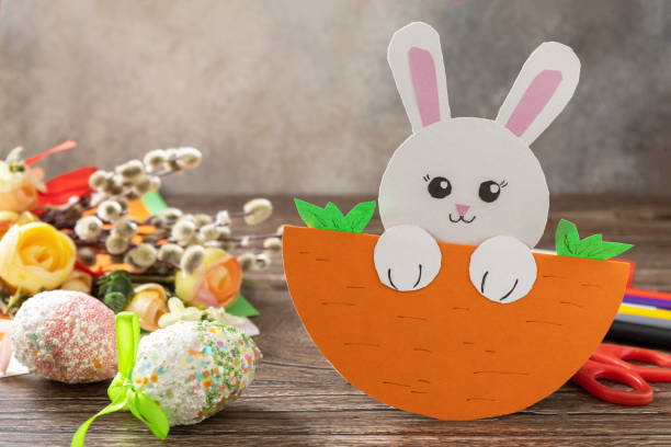 istock Easter card gift Easter bunny on a wooden table. Copy space. Handmade. Project of children's creativity, handicrafts, crafts for kids. 1456220316