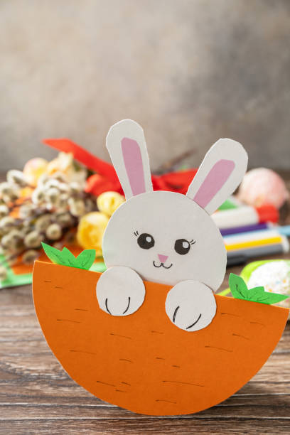 istock Easter card gift Easter bunny on a wooden table. Copy space. Handmade. Project of children's creativity, handicrafts, crafts for kids. 1456220319
