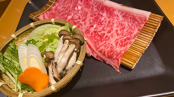 Enjoy a traditional 'shabu-shabu' and 'sukiyaki' hotpot meal with premium Japanese wagyu Saga beef.