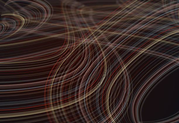 Abstract image of light trails in brown, blue tones along a wavy path. Selective focus.