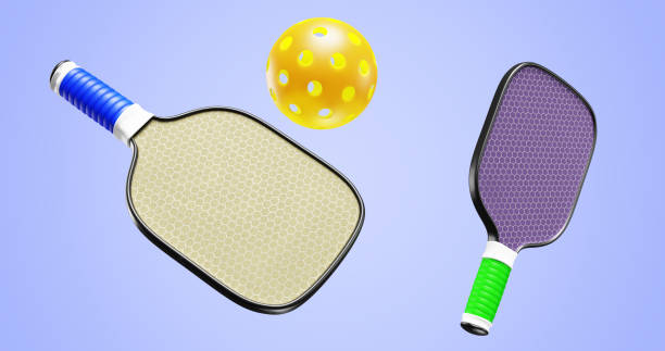 istock Pickleball two racquet paddles and one ball. 3D rendering 1456224790