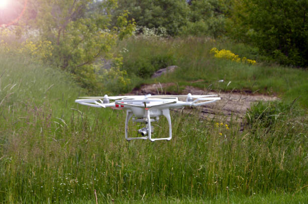 istock drone with professional digital camera takes picture. copter flying or Hexacopter at summer 1456225013