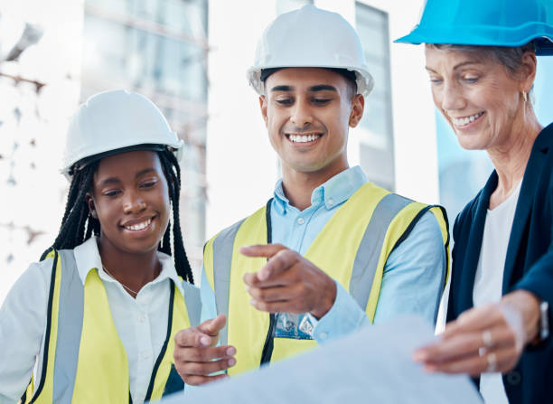 istock Business people, architect and smile for team construction planning, collaboration or industrial strategy with blueprint. Happy engineering workers in building plan for architecture industry on site 1456225088