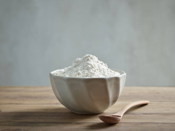istock bowl of flour on wooden kitchen table 1456226355