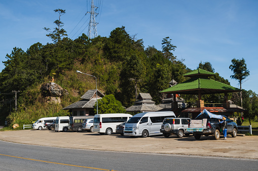 Pai, Thailand. November 23, 2022. Cars and minivans parked at the Doi Kio Lom viewpoint along the Mae Hong Son Loop in Northern Thailand.