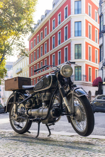 Black retro motorcycle parked in downtown of Lisbon