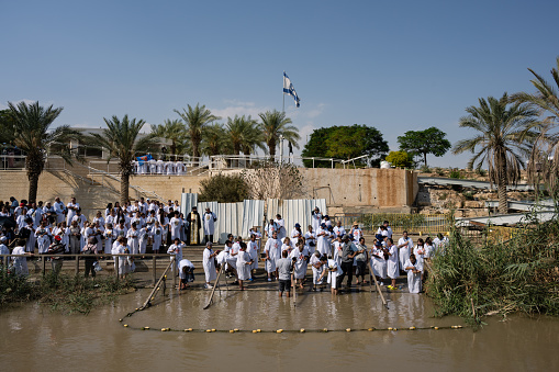 Qas el Yahud, Israel - October 31 2022: Pilgrims being Baptised on the Site of the Baptism of Jesus Christ on the West Bank of the River Jordan.