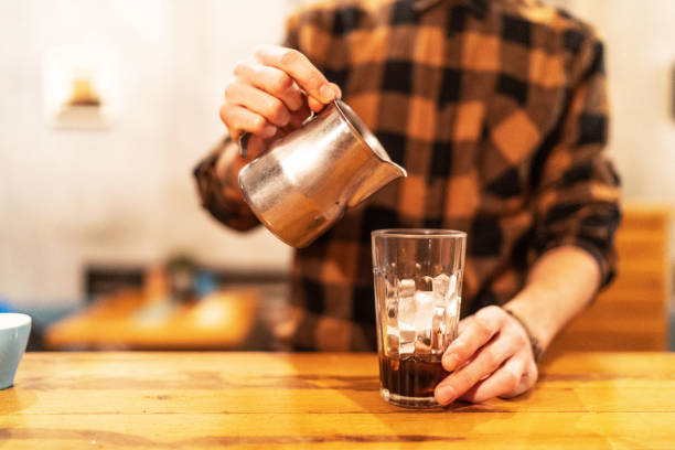 istock Barista pouring miln in coffe 1456235140