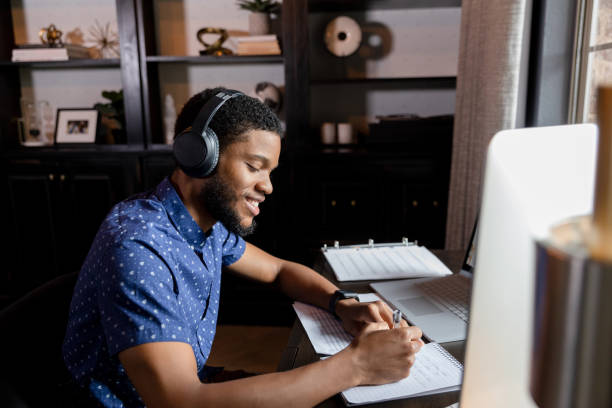 istock Young adult employee taking notes 1456237336