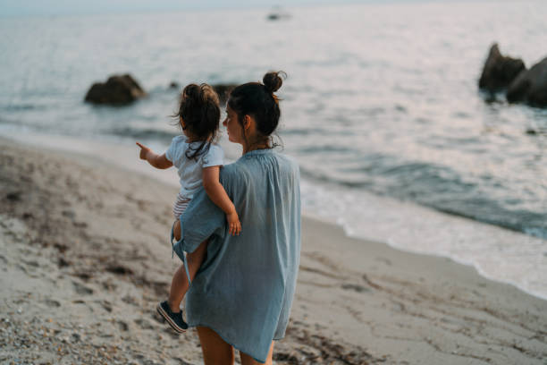 istock Evening walks at the beach with my daughter 1456238983