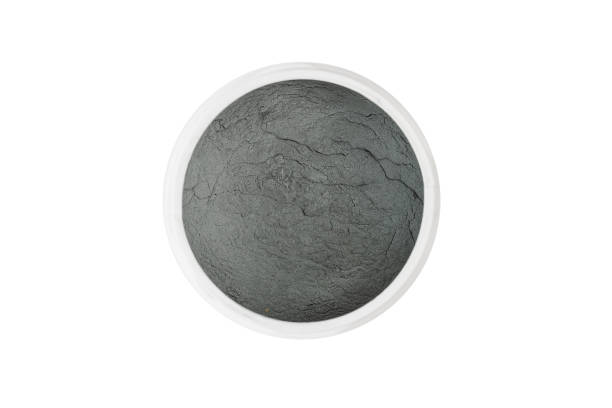 istock Silicon carbide for restore and sharpening stones to original flatness. Silicon carbide abrasive powder for leveling stones isolated on white background. 1456244238
