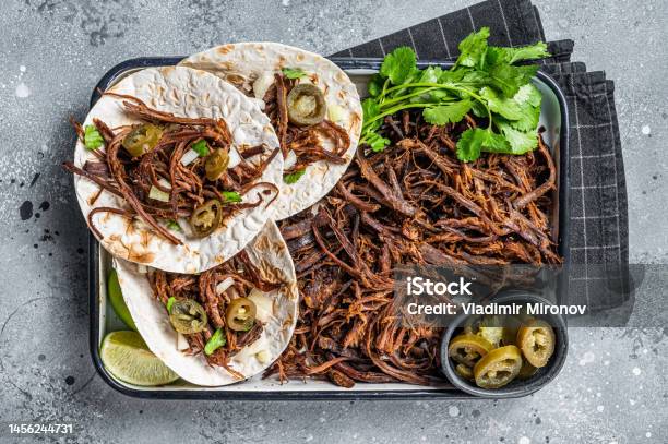Cooking Of Mexican Lamb Barbacoa Tacos With Cilantro And Onion Gray Background Top View Stock Photo - Download Image Now