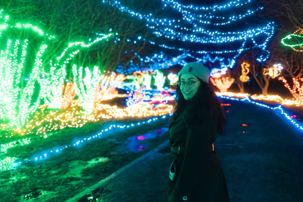 istock Woman at a Christmas Light Park Trail - Wide Angle 1456247093