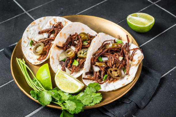 istock Mexican Beef Barbacoa Tacos with Cilantro and Onion. Black background. Top view 1456247213