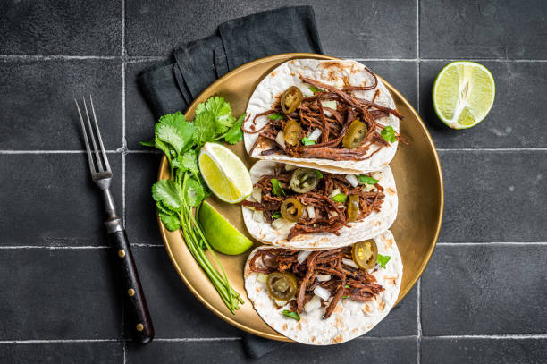 istock Mexican Beef Barbacoa Tacos with Cilantro and Onion. Black background. Top view 1456248021