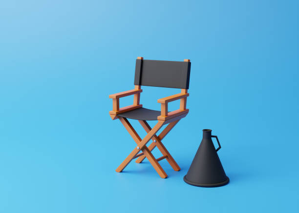 istock Director chair and megaphone on blue background 1456248981