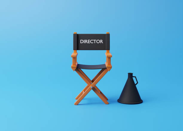 istock Director chair and megaphone on blue background 1456248983
