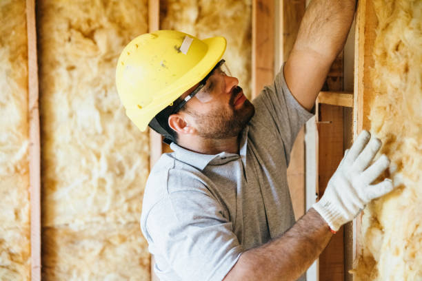 Construction worker fitting insulation stock photo
