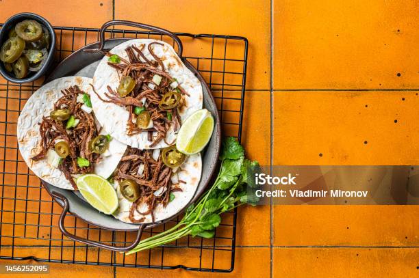 Spicy Beef Barbacoa Tacos With Cilantro And Onion Orange Background Top View Copy Space Stock Photo - Download Image Now