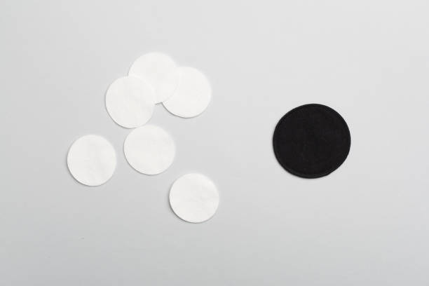 istock Reusable cotton pads with disposable ones on color background, top view 1456252446
